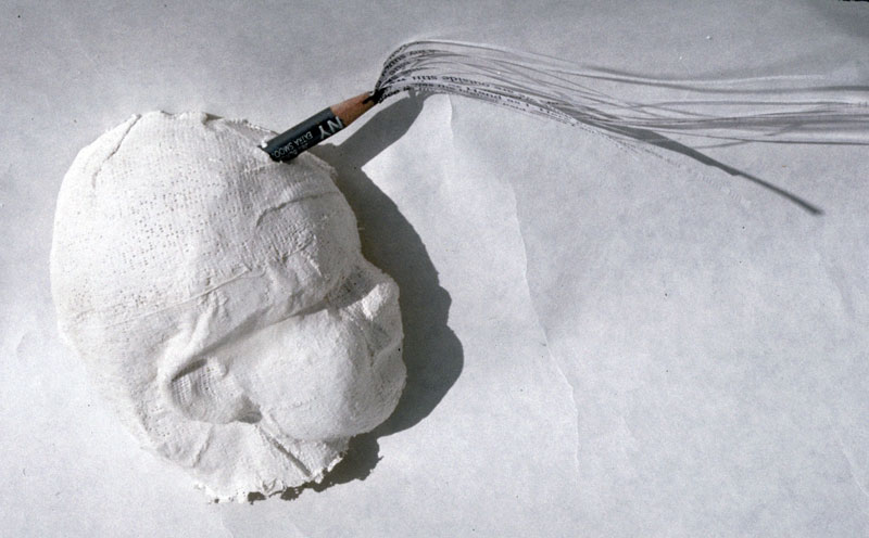 Head Poem, 1995, 6"w x 3"h, Plaster and shredded paper